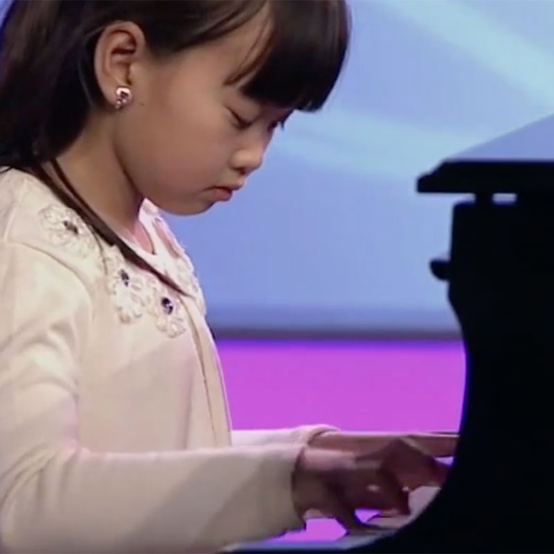 HSSM student playing piano at concert