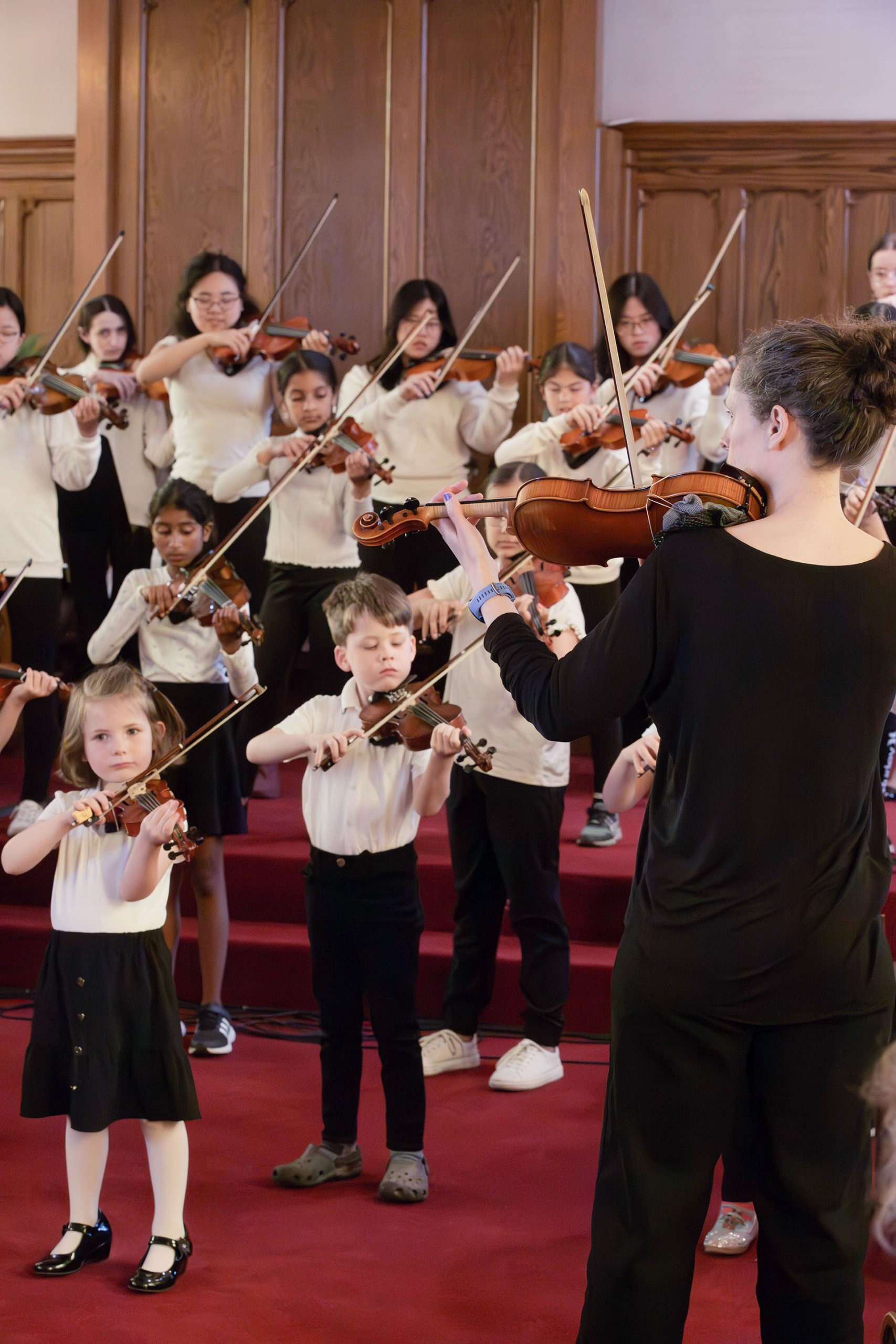 Strings concert - students with teacher